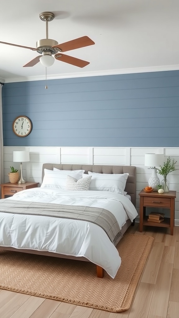A modern farmhouse bedroom featuring a coastal blue accent wall and a neatly made bed with light bedding.