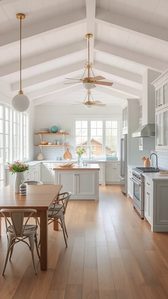 A bright open-concept kitchen featuring white beams, large windows, and a wooden dining table.