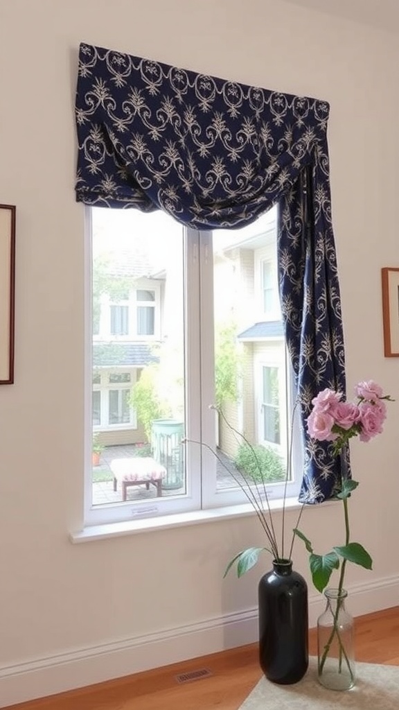A window with a navy blue patterned valance draped above it, accompanied by pink flowers in vases.